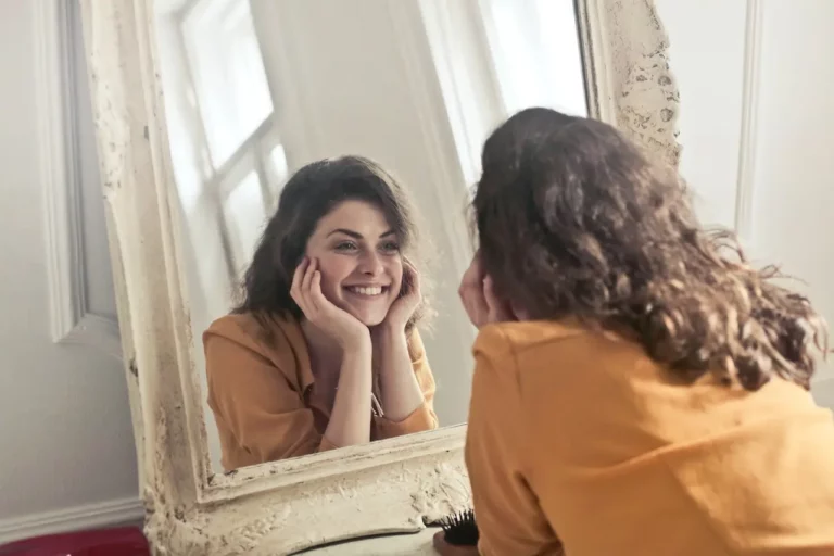 lady looking into mirror trying to reconnect with self